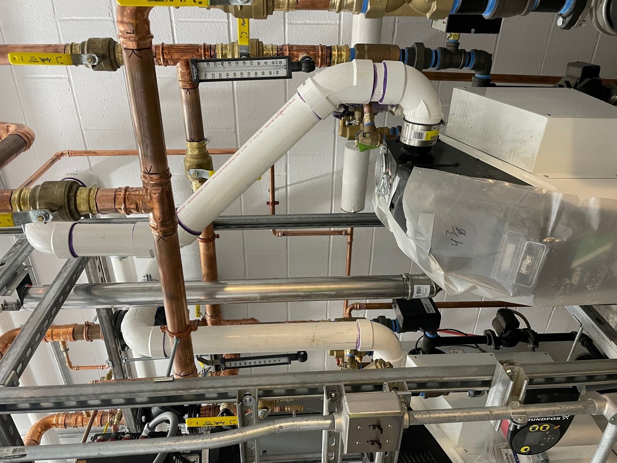 Installation of Boiler Intake Piping through the Wall